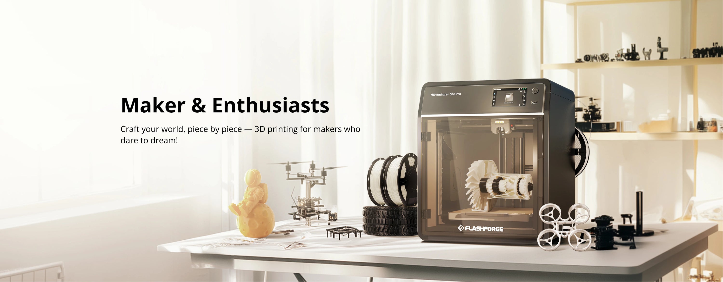 Flashforge 3D printer with maker projects and tools displayed.